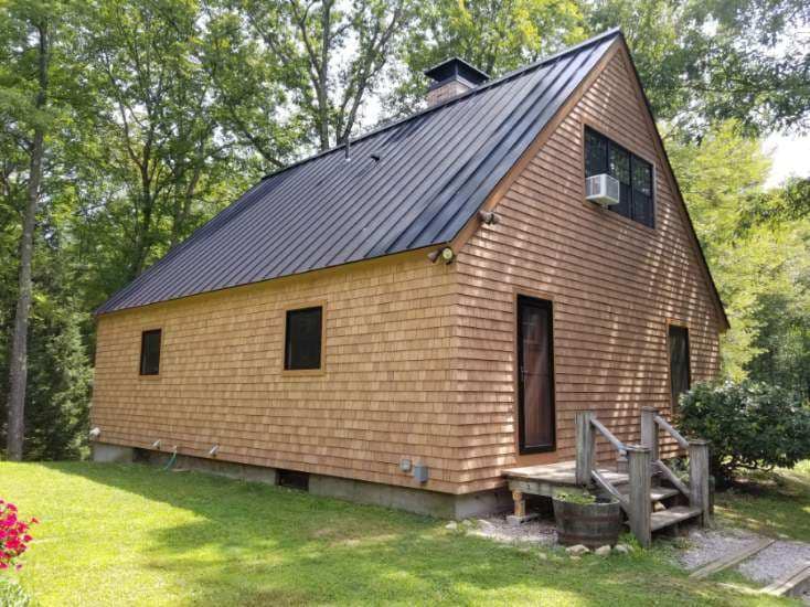 Cedar siding and standing seam metal roof, Auburn NH
