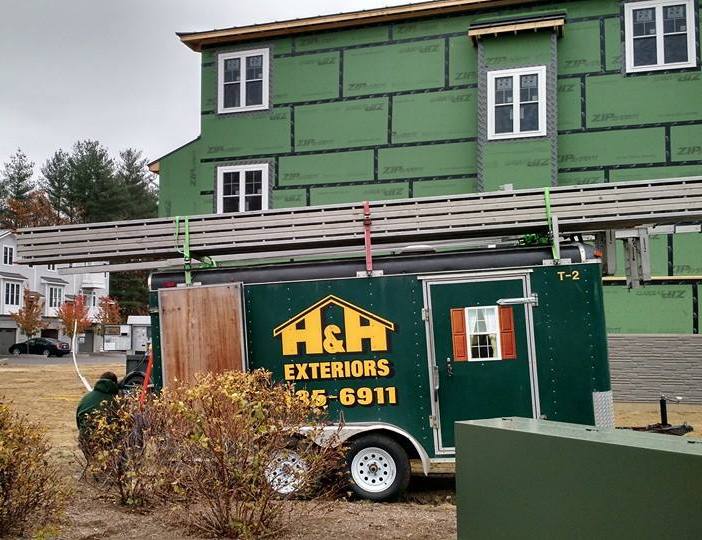 H&H Exteriors job site trailer at a siding replacement in New Hampshire
